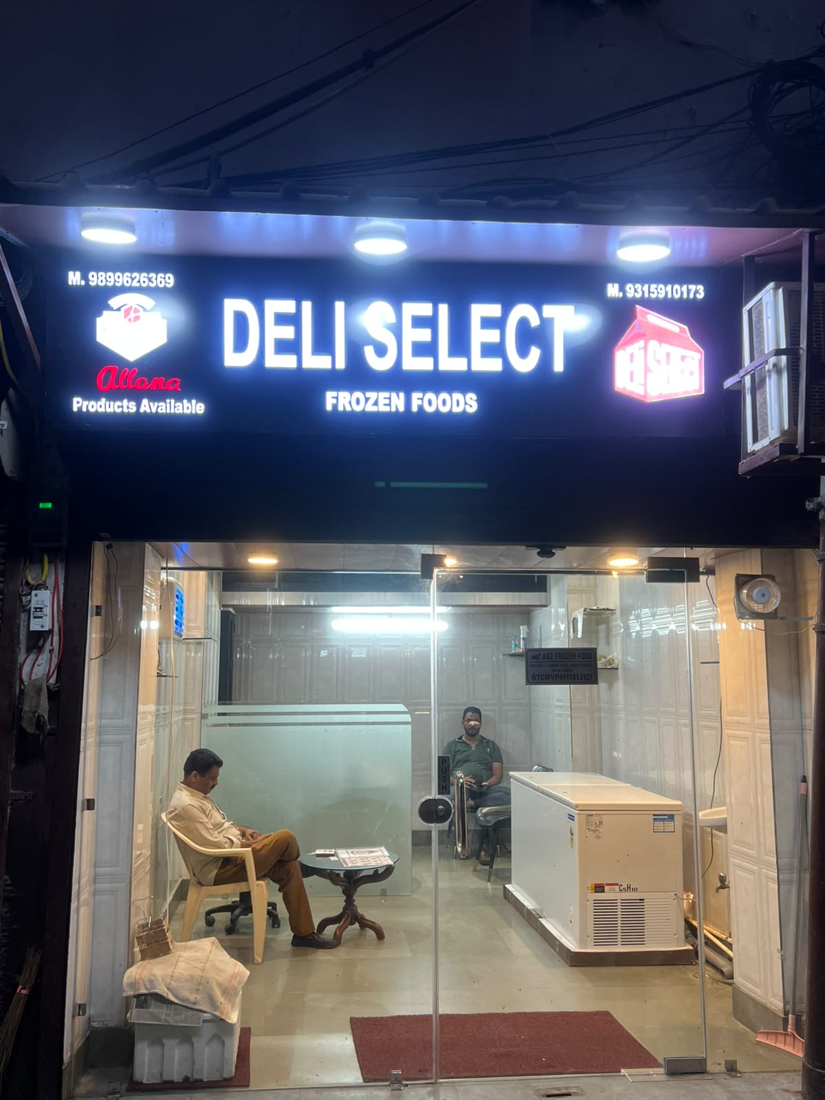 Deli Select Frozen Foods storefront and illuminated sign
